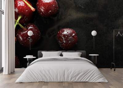 Fresh sweet cherries on a black background Wall mural