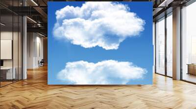 Two white clouds isolated over blue background Wall mural