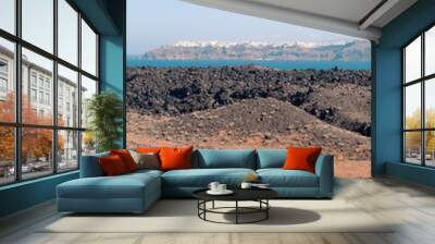 View on the Nea Kameni volcano island near Santorini island at sunny weather at Greece Wall mural