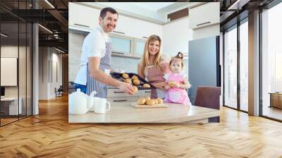 A happy family prepares baking in the kitchen Wall mural