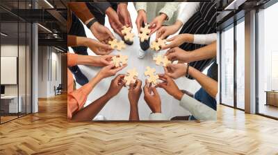 business and cooperation. multiracial people stand in circle and connect wooden pieces of puzzles th Wall mural