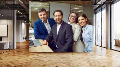 Collaborative work as a diverse group of business people standing together at office. Group portrait captures the essence of a cohesive business community and success of work partnership. Wall mural