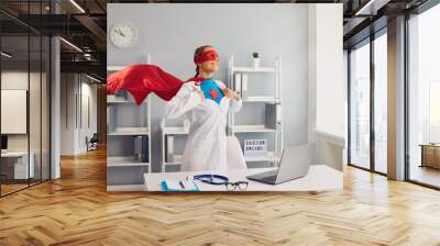 Confident female doctor superhero in a hospital office. Medical protection of human health. Wall mural