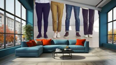 cropped indoor low section shot of people's legs. group of employees of different sexes and genders  Wall mural