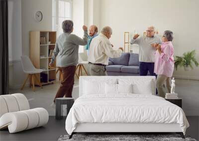 Full length portrait of a group of happy smiling senior people men and women having fun and dancing enjoying activities in retirement home together. Leisure time in nursing home concept. Wall mural