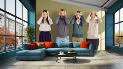 Group of adult people feeling surprised, shocked, anxious and scared. Four male and female corporate office workers panicking because of deadline or unexpected troubles at work. Fear and panic concept Wall mural