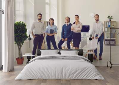 Group of young professionals standing in modern office ready for corporate meeting Wall mural