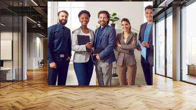 Group photo of Multi ethnic team for companys website. Colleagues stand shoulder to shoulder in their own modern office. Banner size. Successful business team smiling and posing at office. Wall mural