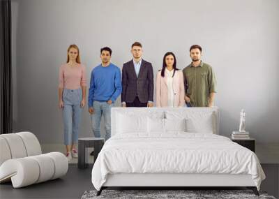 group portrait of young people in smart casual clothes. team of 5 unsmiling corporate employees in j Wall mural