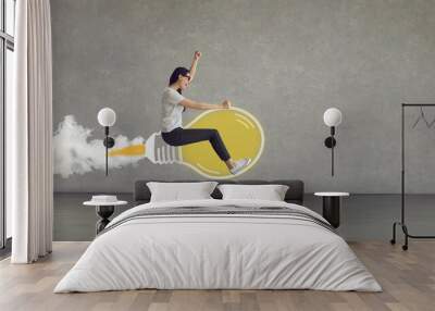 Make dream come true. Side view confident hipster girl with drive to succeed riding yellow cartoon doodle idea light bulb rocket. Modern business header, year 2021 ultimate gray and illuminating color Wall mural