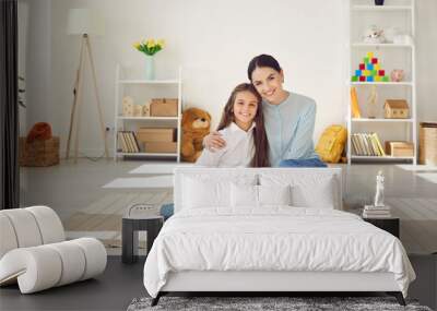 portrait of mother and child. happy family spending time at home. mom and kid posing for photo. beau Wall mural