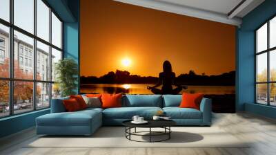 The concept of yoga, harmony, meditation, health. Silhouette of Wall mural