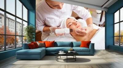 Woman on facial skincare procedure.
Hardware cosmetology. Wall mural