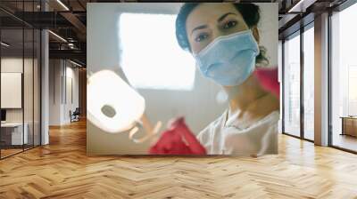 Female dentist in dental office examining patient teeth, patient point of view.  Wall mural