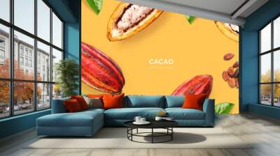 Creative layout made of cacao beans and  cacao fruit on the yellow background. Flat lay. Food concept. Macro  concept. Wall mural