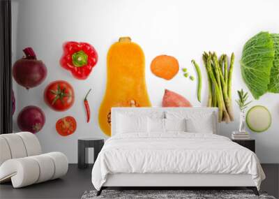 Creative layout made of green peas, cabbage, sweet potato, avocado, tomato, onion, beetroot, pepper, aubergine, artichoke, broccoli and cucumber on the white background.. Flat lay. Food concept.  Wall mural