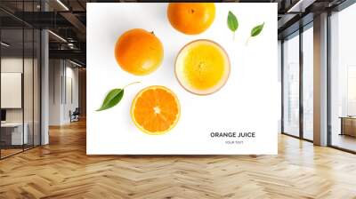 Creative layout made of orange juice. Flat lay. Food concept. Orange on the white background. Wall mural