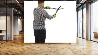 Young man is working with big secateur. Rear view. Three quarter length isolated on white. Wall mural