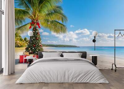 Christmas in southern hemisphere with a palm tree with christmas decorations and gift boxes on tropical beach with white sand and beautiful blue sea view and copy space Wall mural