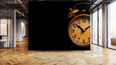 Vintage Gold Alarm Clock Isolated on Black Background Wall mural