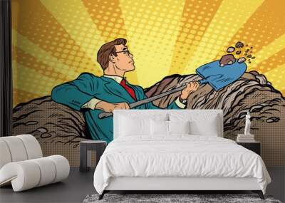 Businessman with a shovel digging Wall mural