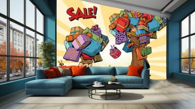 Holiday sales, a couple man and woman with shopping Wall mural