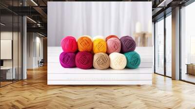 rolls of colorful yarn on a white table Wall mural