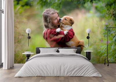 Teenage girl with cute bordertoller mix breed puppy Wall mural