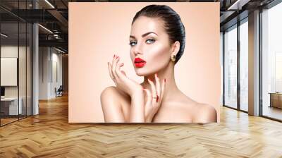 Beautiful sexy brunette woman with luxury makeup and manicure Wall mural