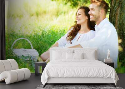 Beautiful Young Couple Having Picnic in Countryside Wall mural