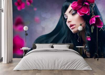 Beauty Brunette Model Girl with Big Purple Flowers in her Hair Wall mural