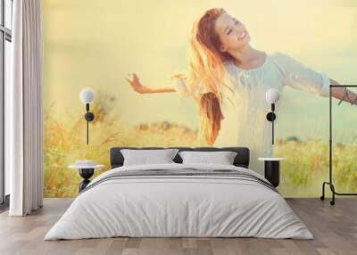 beauty model girl in white dress having fun on summer field Wall mural