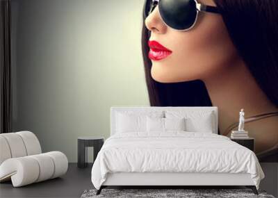 Beauty model girl with long brown hair wearing sunglasses Wall mural