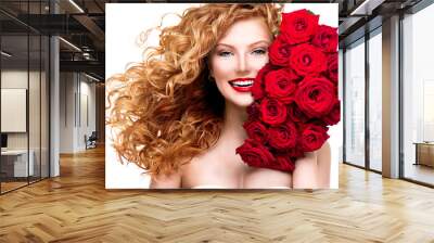 beauty woman with long permed red hair and beautiful red roses Wall mural