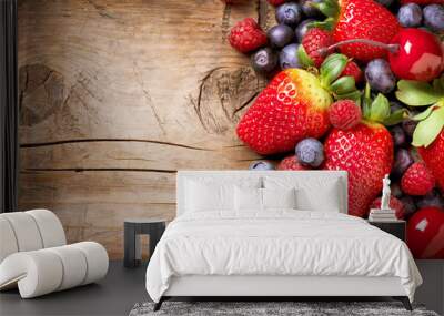 berries on wooden background. organic berry over wood Wall mural