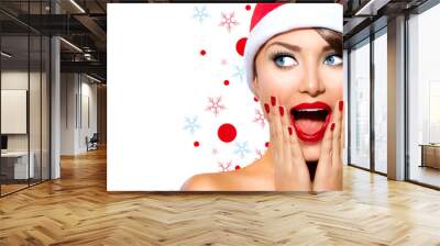 Christmas Woman. Beauty Model Girl in Santa Hat Wall mural