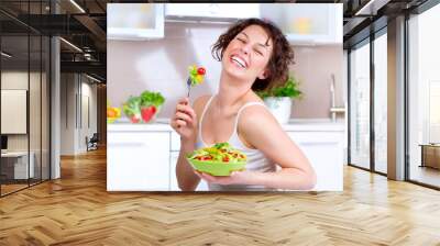 Diet. Beautiful Young Woman Eating Vegetable Salad Wall mural