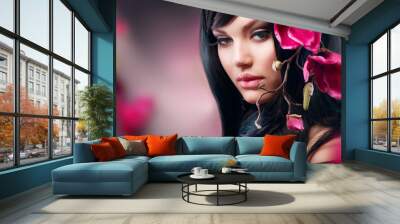 Fashion Brunette Girl with Magnolia Flower Wall mural