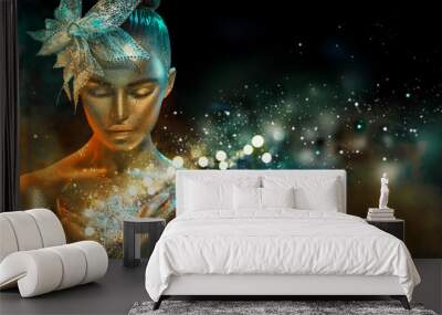 Fashion model woman in colorful bright golden sparkles and neon lights posing with fantasy flower. Portrait of beautiful girl with glowing makeup Wall mural