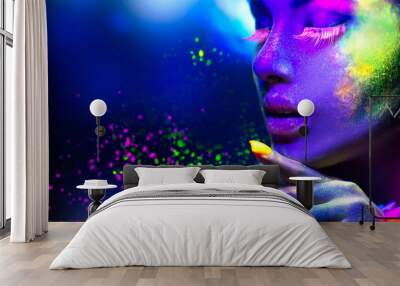 Fashion woman in neon light, portrait of beauty model with fluorescent makeup Wall mural