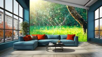 Garden, Grass Watering. Smart garden activated with full automatic sprinkler irrigation system working in a green park, watering lawn, flowers and trees. sprinkler head watering. Gardening concept. Wall mural