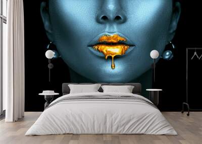 Gold paint drips from the sexy lips, golden liquid drops on beautiful model girl's mouth, creative abstract dark blue skin makeup. Beauty woman face Wall mural