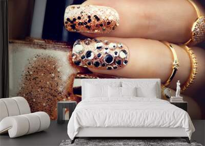 Golden holiday style bright manicure with gems and sparkles. Trendy accessories Wall mural