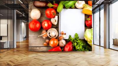 open notebook and fresh vegetables background. diet Wall mural