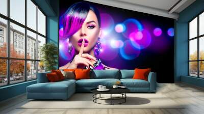 Sexy beauty fashion woman with purple dyed fringe hairstyle isolated on black background Wall mural