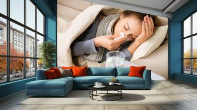 Sick Woman. Flu. Woman Caught Cold. Sneezing into Tissue Wall mural