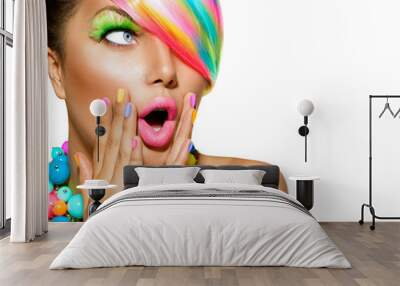 surprised woman with colorful makeup, hair and nail polish Wall mural