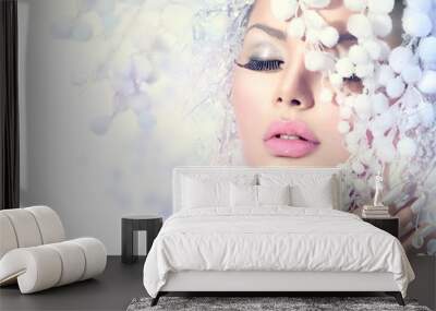 Winter Beauty. Beautiful Fashion Model Girl with Snow Hairstyle Wall mural