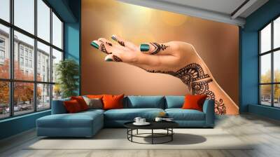 Woman's hand with mehndi tattoo. Hand of Indian bride with black henna tattoos Wall mural