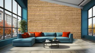 Closeup of a trendy straw wallpaper of ethnic style. Woven pattern background with bamboo and grass. Wall mural